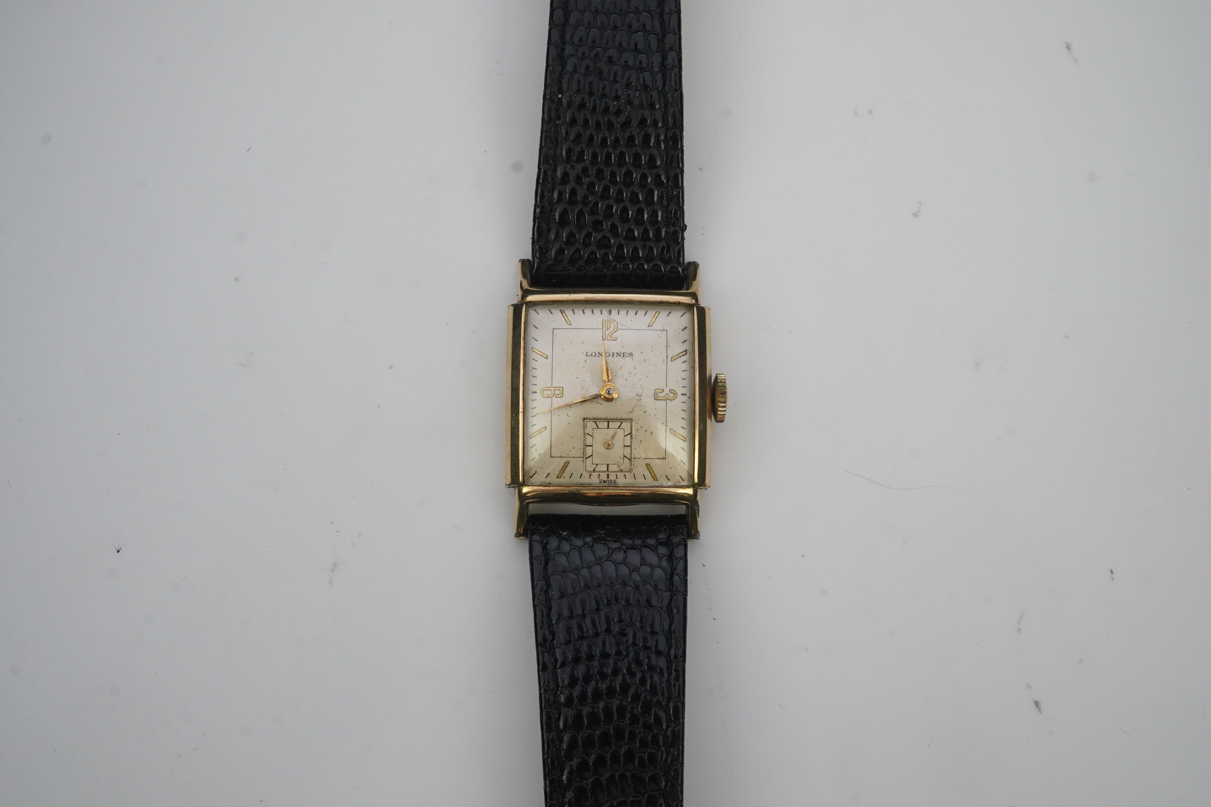 A gentleman's late 1940's gold plated Longines manual wind wrist watch, on a later associated leather strap